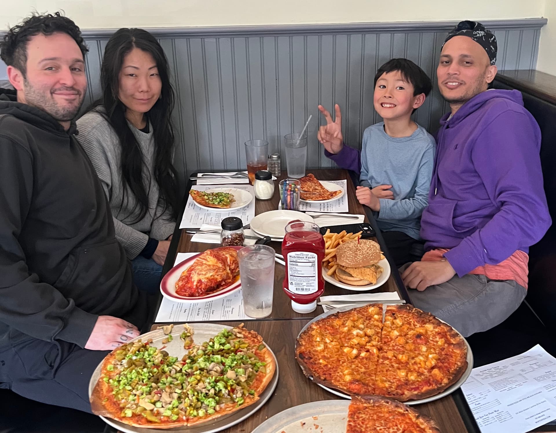 Tim Maslow, Mallory Shackford, Mohammed Islam, and pizza